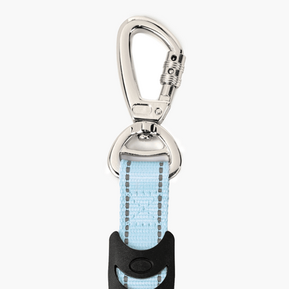 Keychain with light blue strap and silver carabiner on a white background