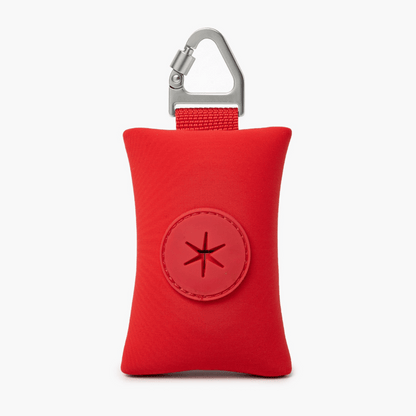 Compact red dog poop bag holder with carabiner, ideal for clean and stress-free walks.

