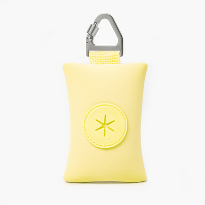Compact Yellow dog poop bag holder with carabiner, ideal for clean and stress-free walks.
