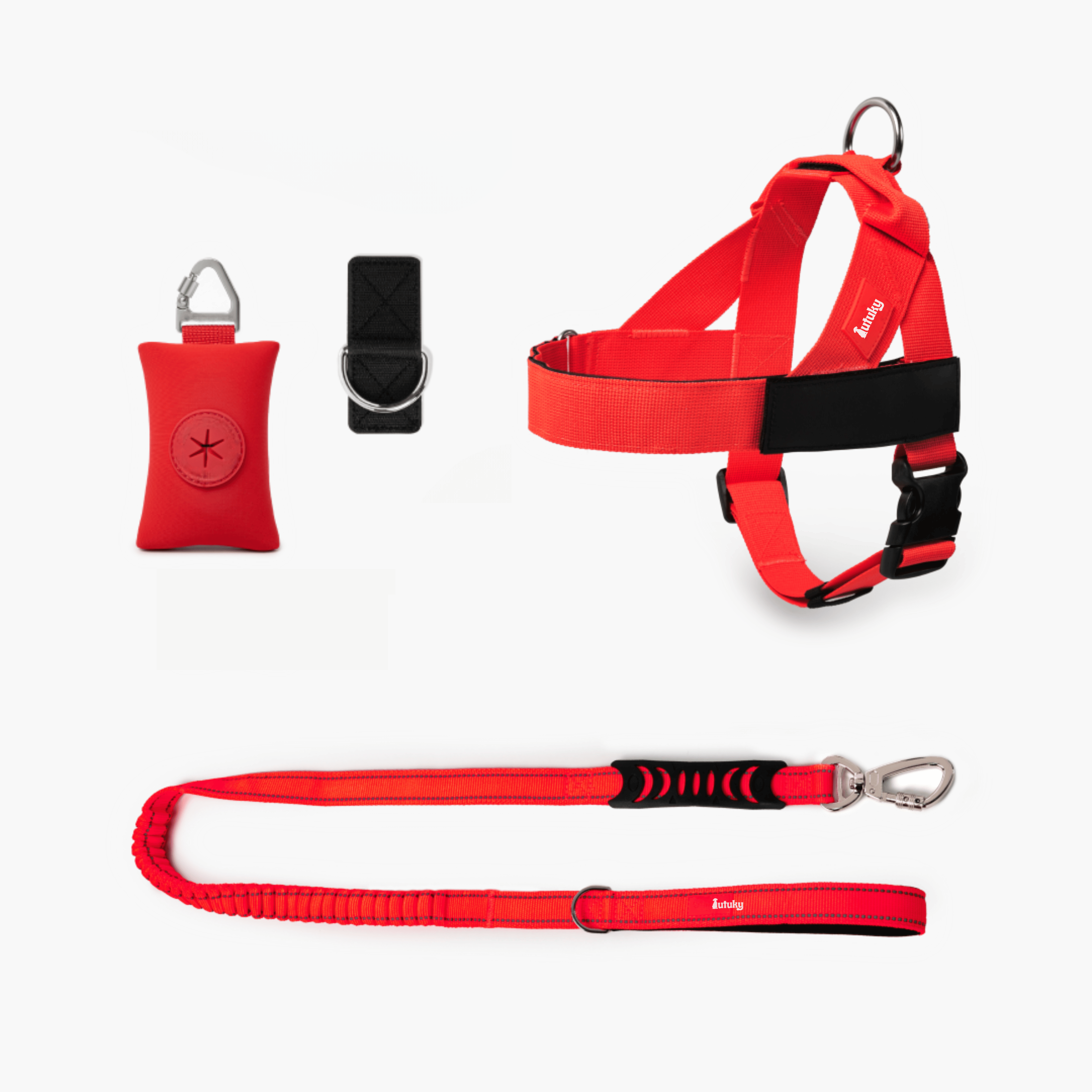 Red and black dog harness, leash, and training tool set on a white background