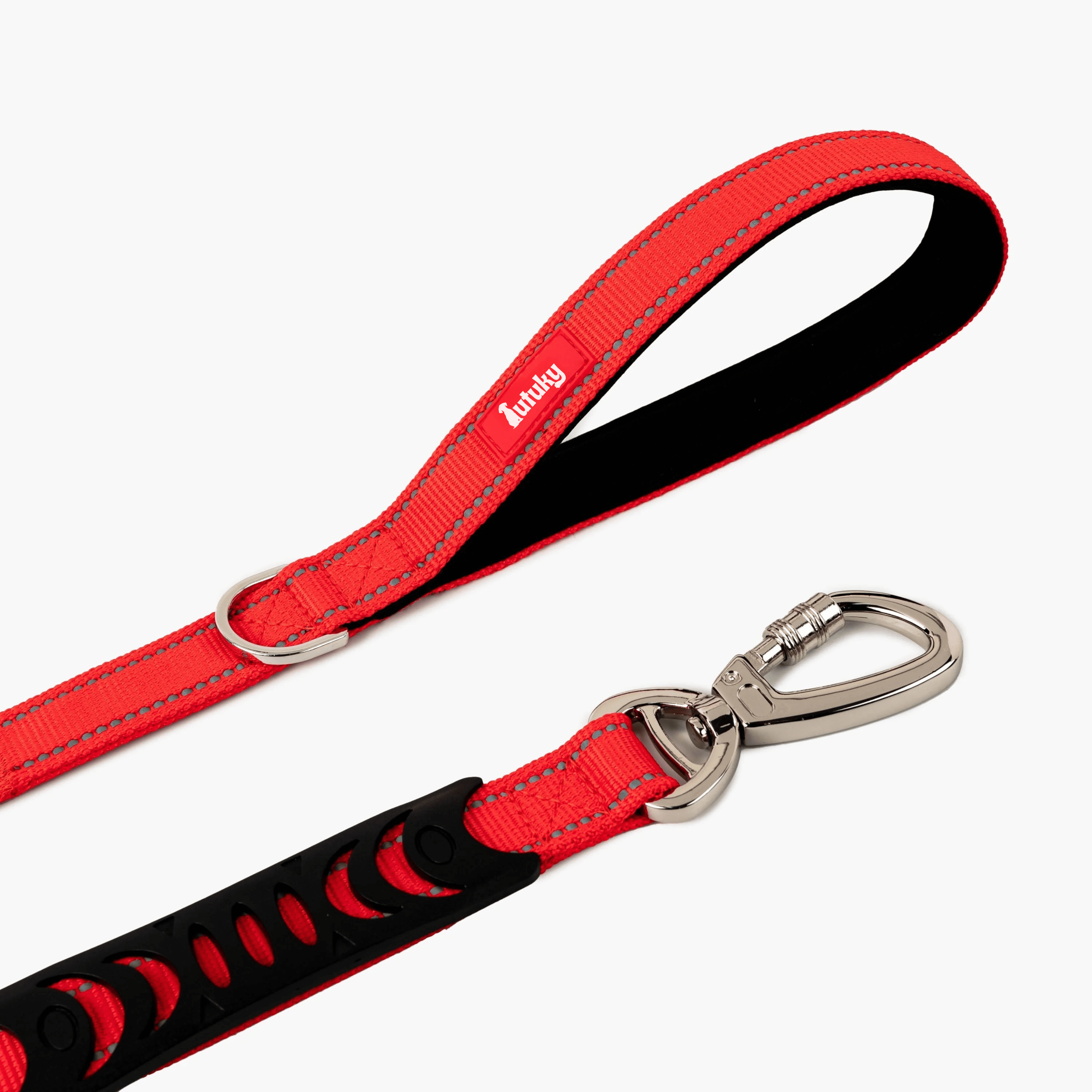 Red dog leash with black and silver hardware on a white background