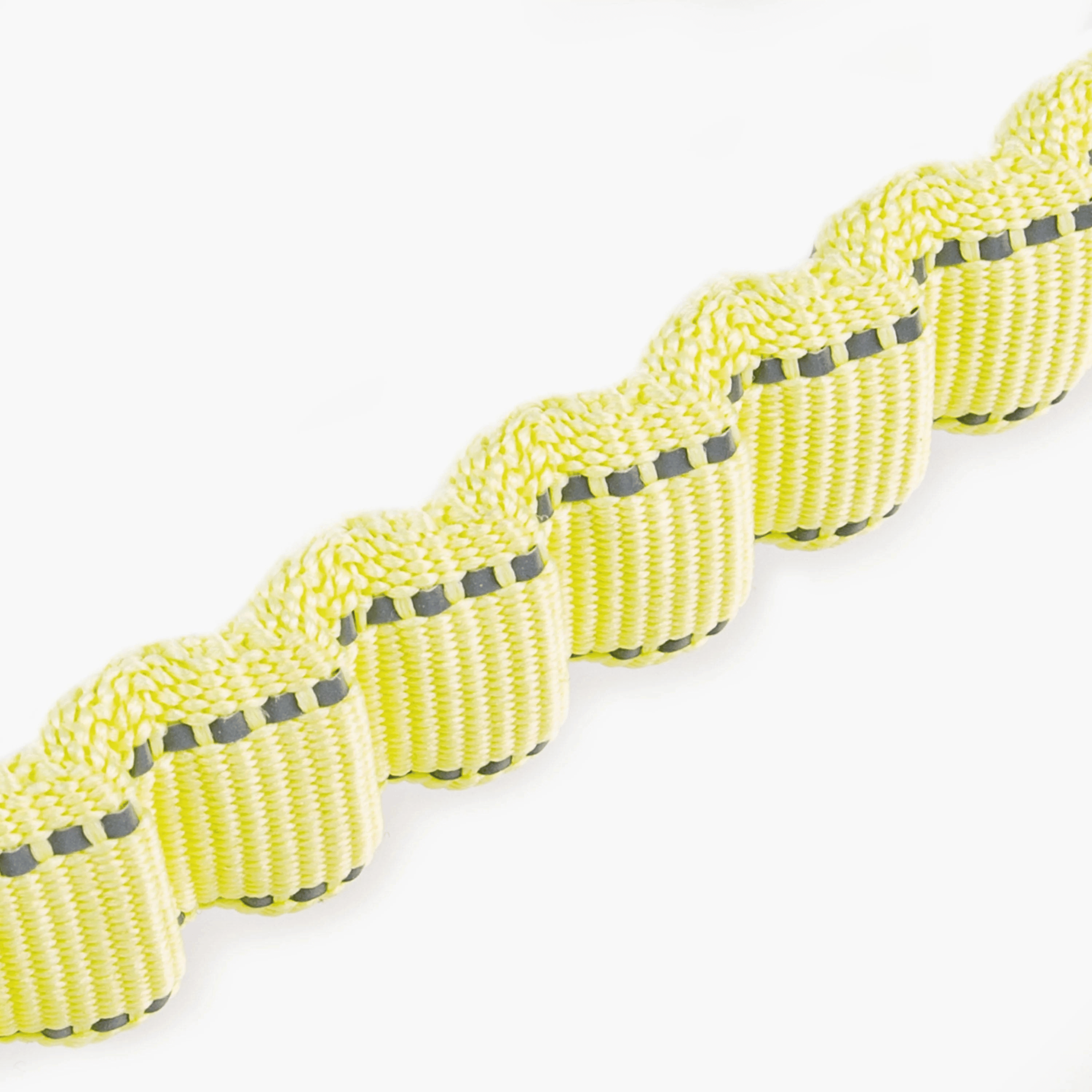 Yellow dog leash with black handle on a white background