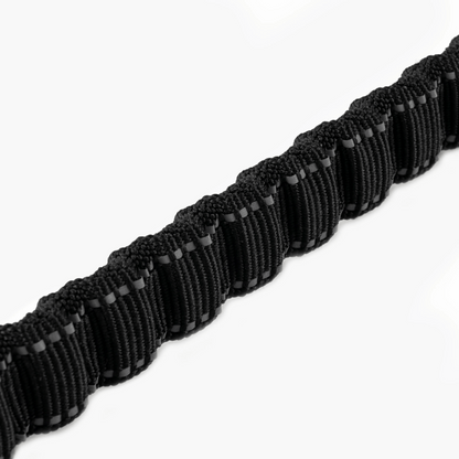 Black dog leash CalmFlow™ with metal clip on a white background
