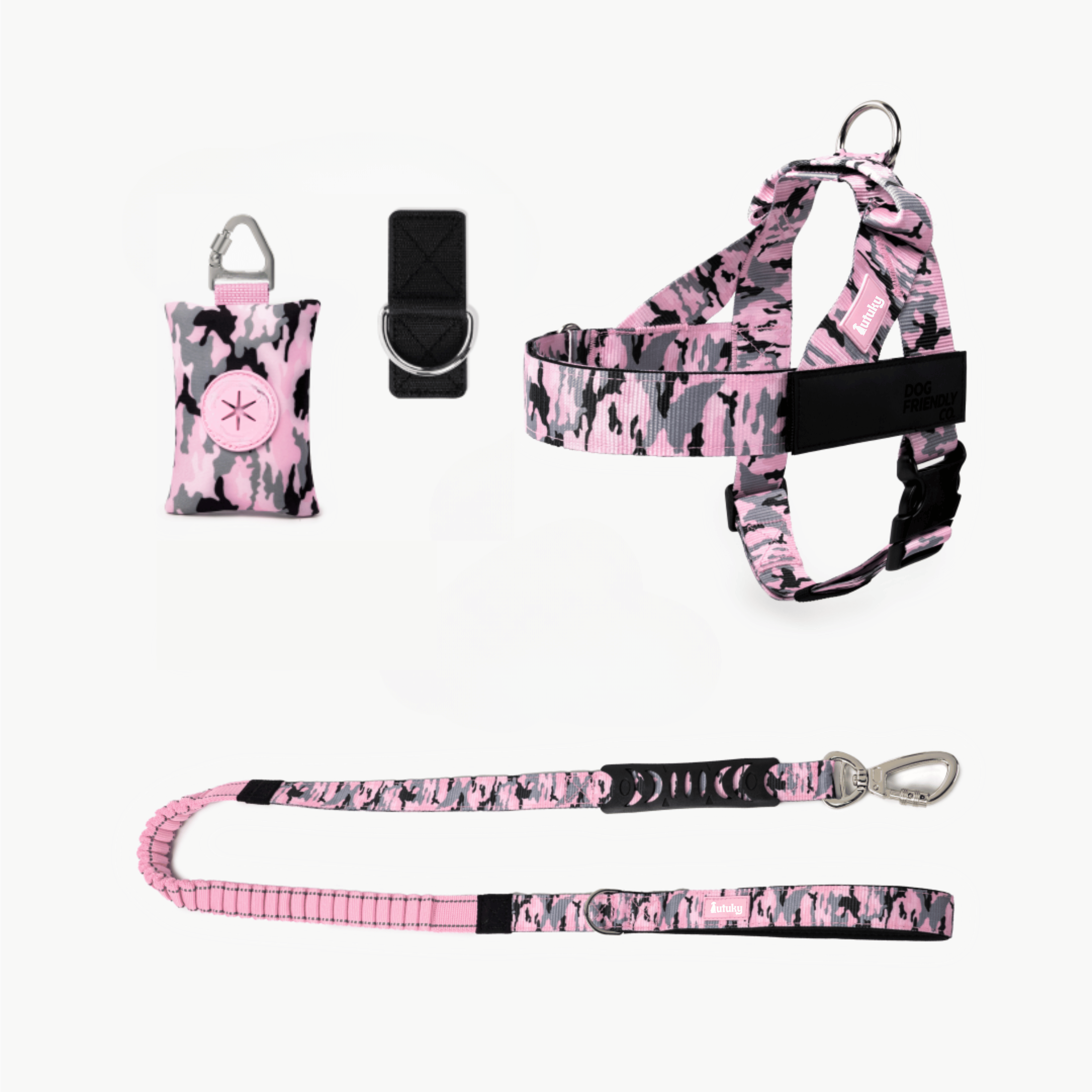 Pink and black patterned dog harness, leash, and bag set on a white background