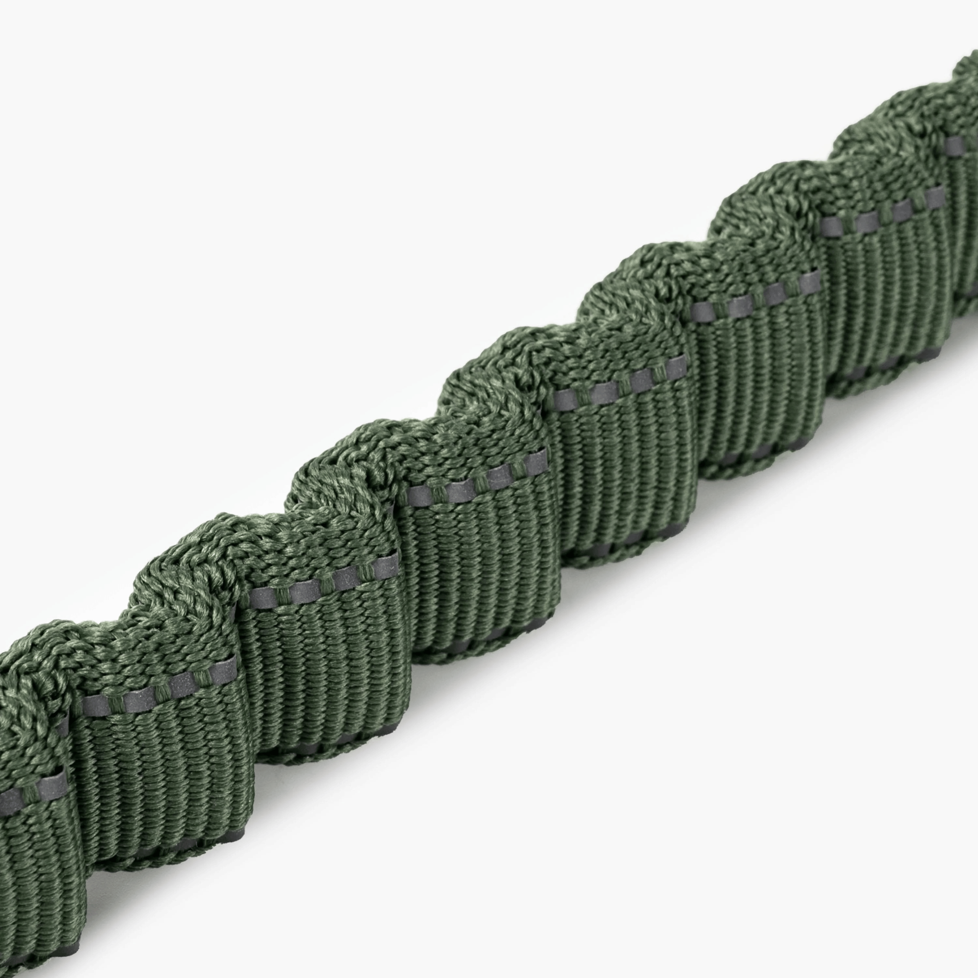Camo-patterned dog leash with a metal clip on a white background